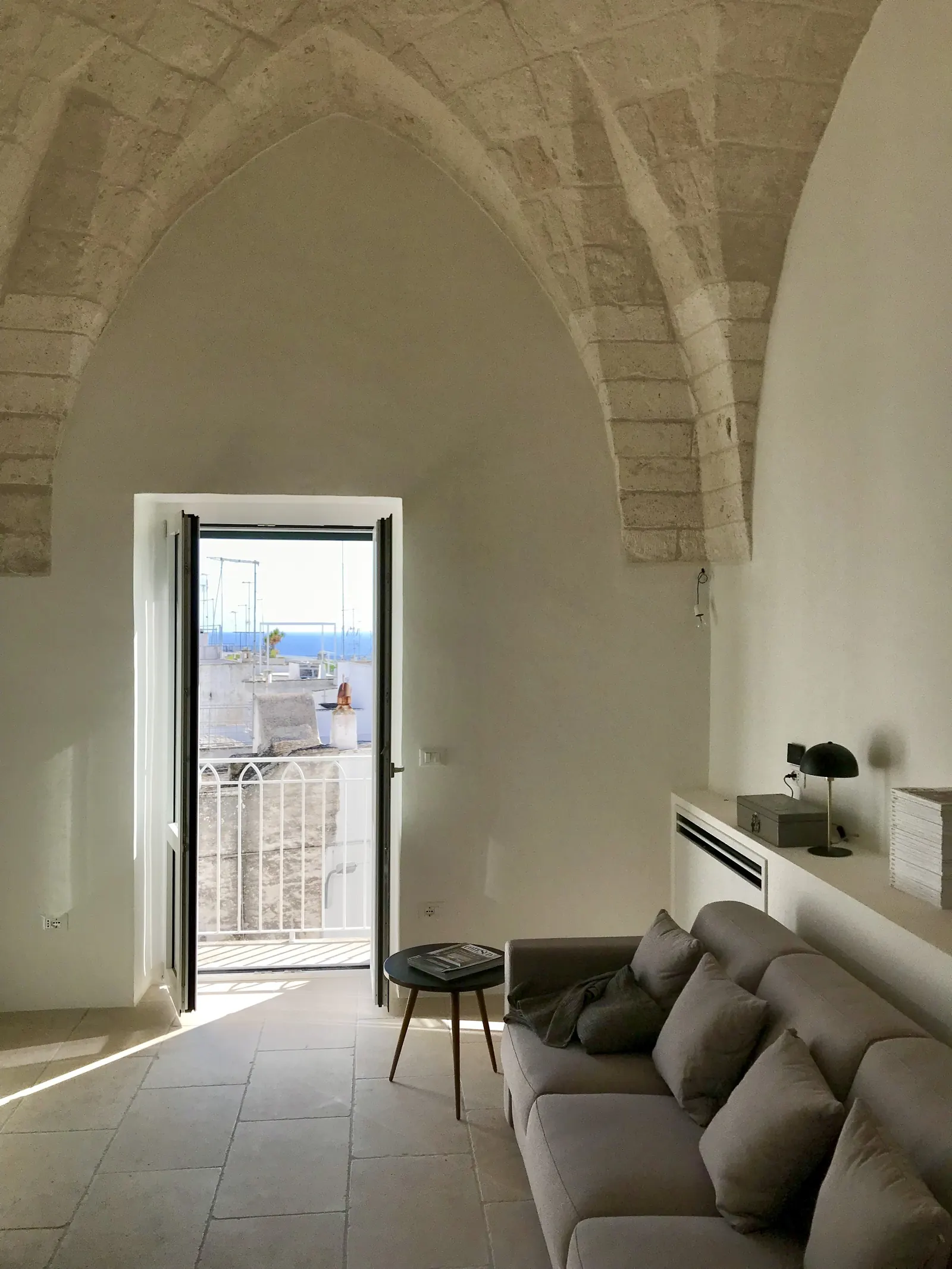 Sitting room with balcony door and vaulted ceiling