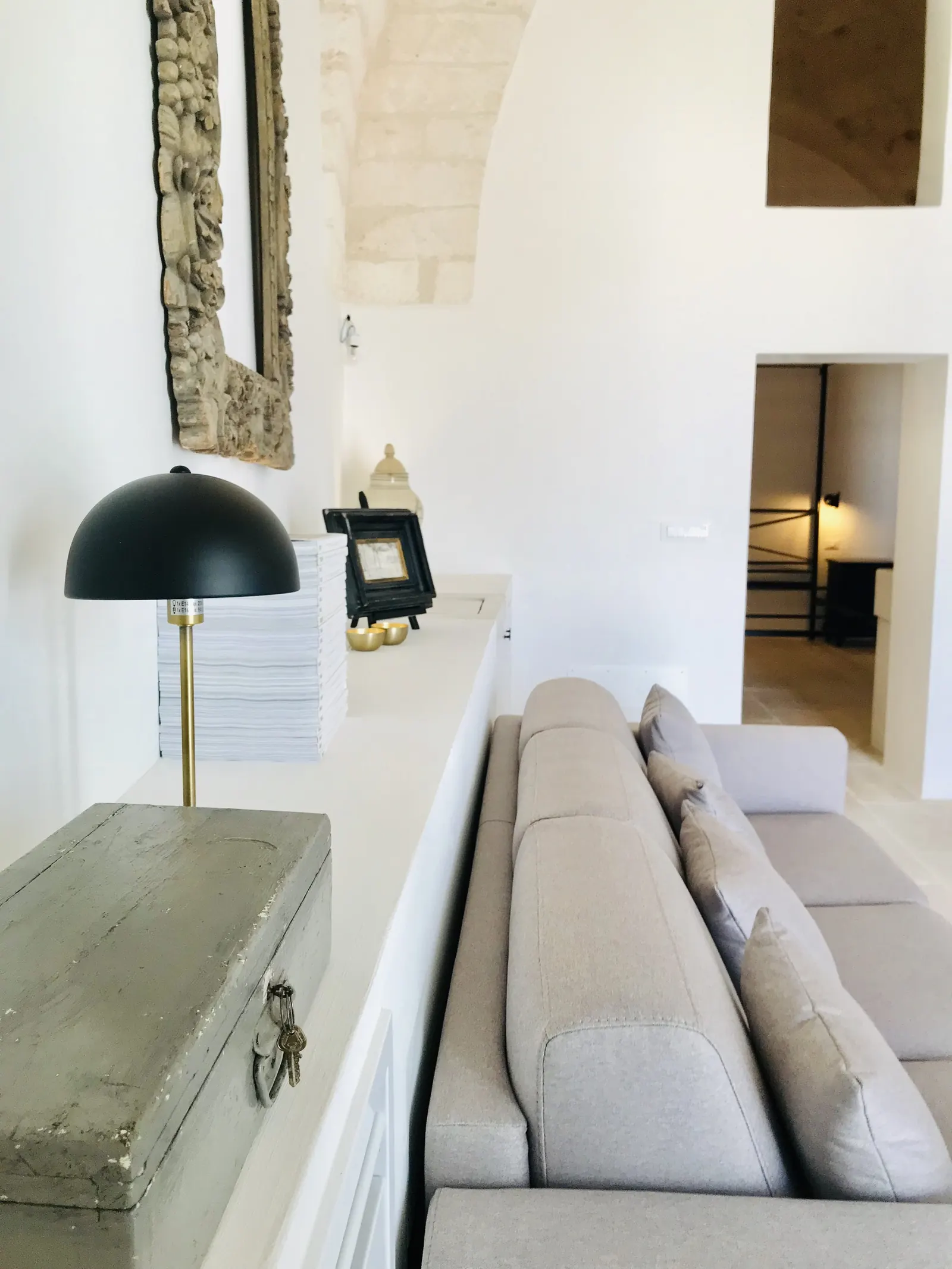 Sofa bed beneath the stone wall