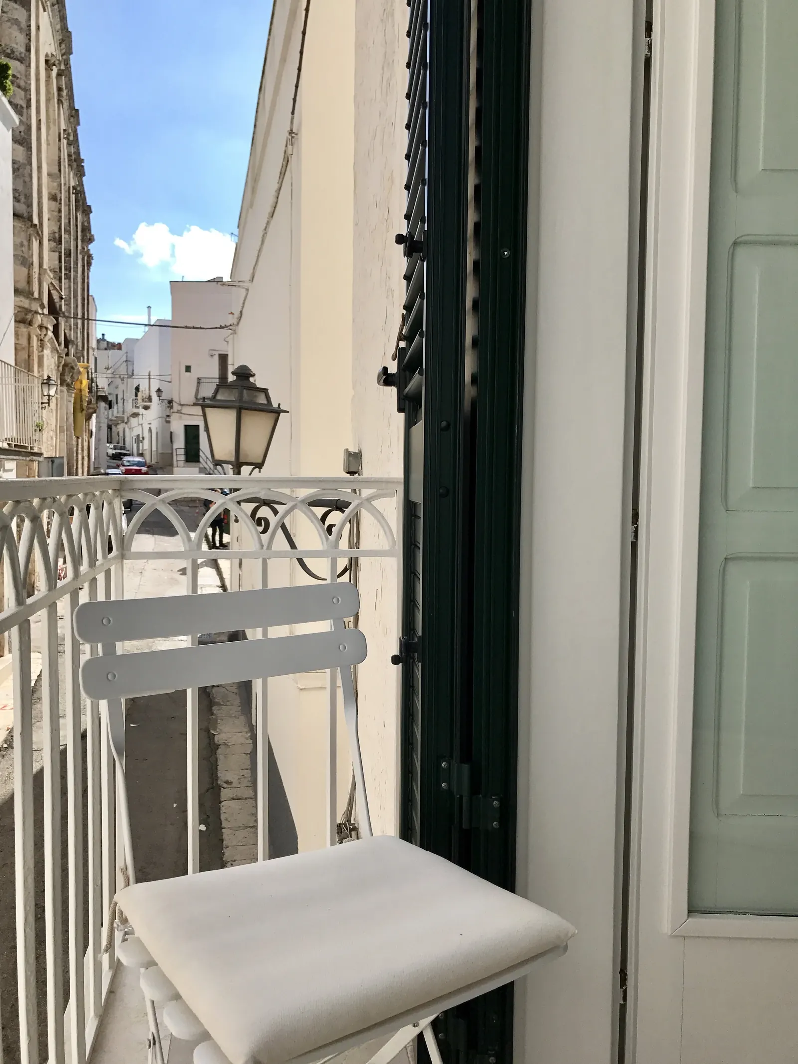 Balcony chair looking down the street