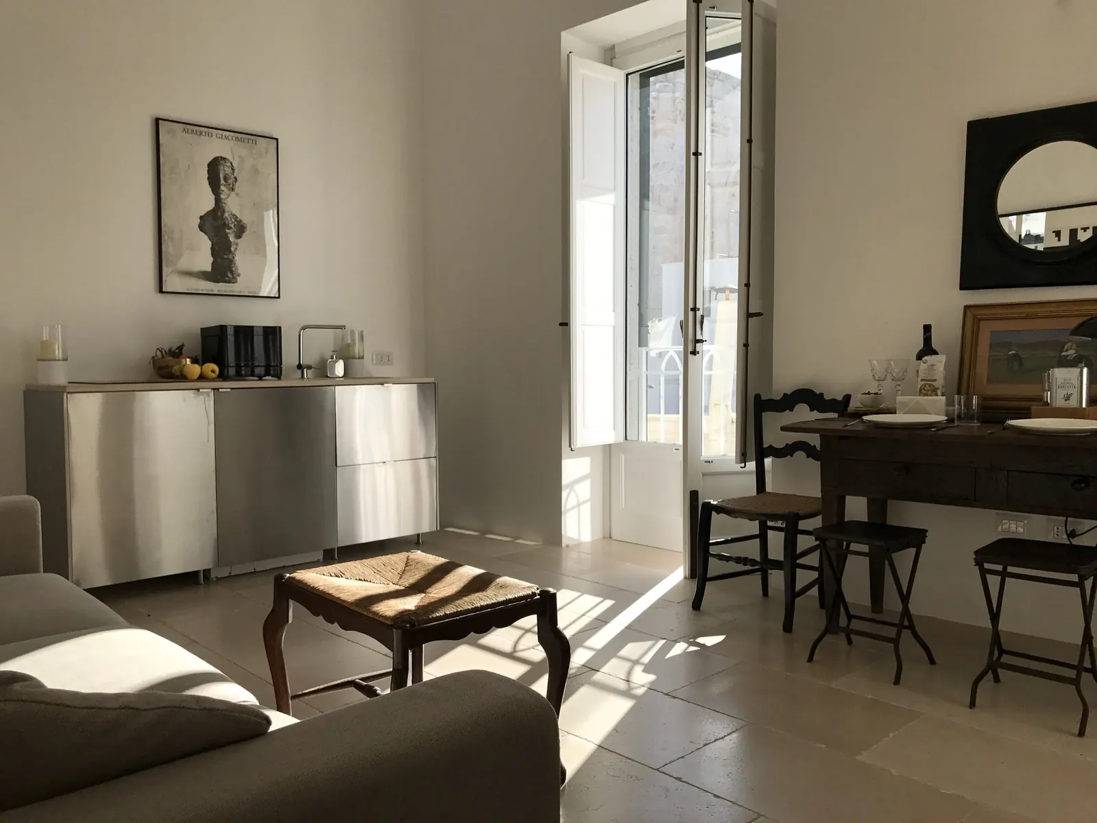 Sitting room with dining table and balcony doors