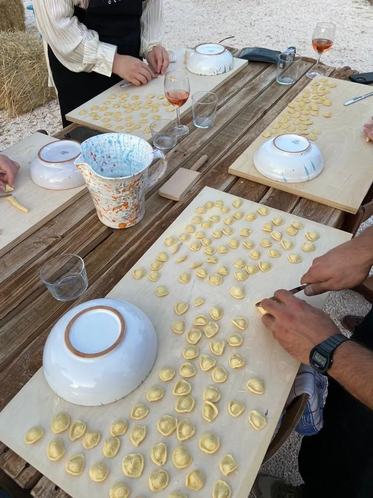 Handmade orecchiette drying on wooden boards